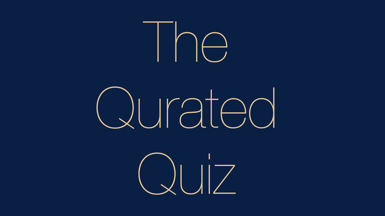 The Qurated Quiz in champagne lettering on a navy background